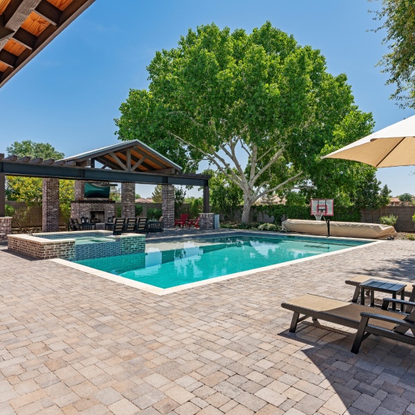 modern pool with patio and outdoor kitchen